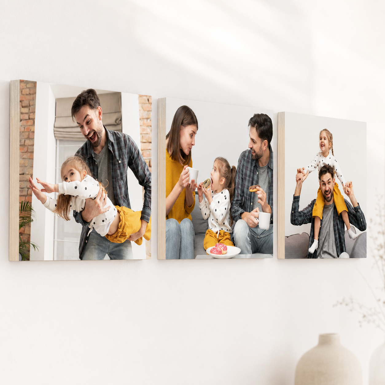 Family photo blocks displayed on a shelf at home